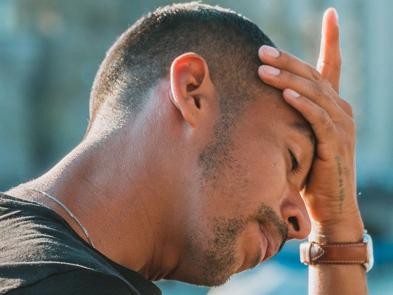 Tired, exhausted man to illustrate hormone imbalance in men