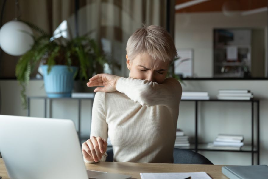 Licensed FILE #: 335592149 Preview Crop Find Similar DIMENSIONS 6570 x 4380px FILE TYPE JPEG CATEGORY People LICENSE TYPE Standard or Extended Front view young female manager with short haircut coughing or sneezing in elbow while working on laptop in office room. Ill businesswoman suffering from virus infection, having sickness symptoms.