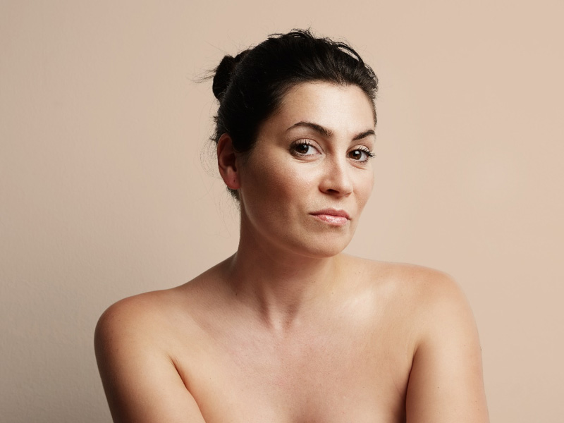 Mature woman looking thoughtful to illustrate considering Morpheus8 treatment