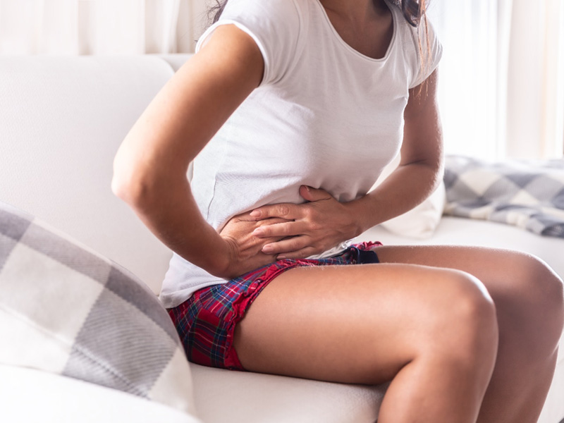 woman golding stomach to illustrate unhealthy gut problems