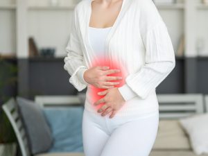 woman experiencing endometriosis pain causing a hysterectomy