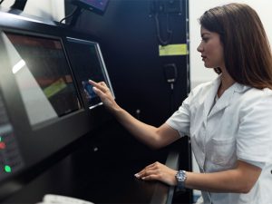 young doctor monitoring a medical procedure to illustrate hyperbaric oxygen therapy