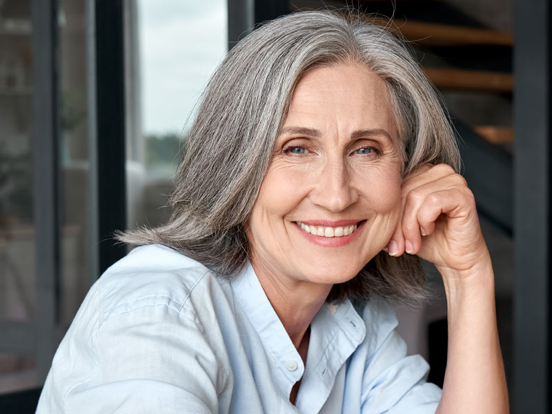 smiling lady to happy with the results of her recent peptide therapy