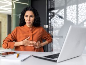 anxious business woman wondering about risks of BHRT for menopausal symptoms