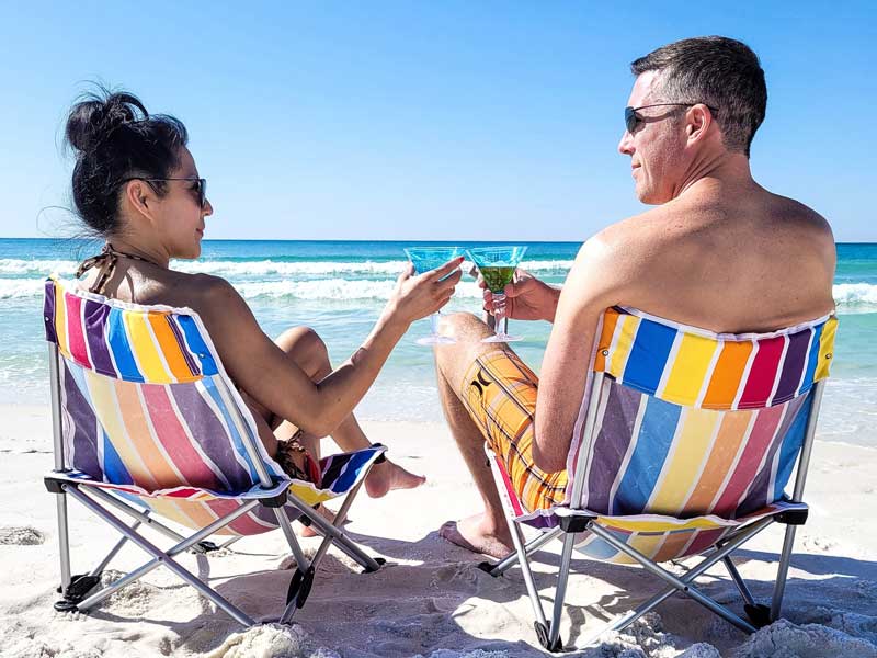 couple on beach looking fit and well toned to illustrate Emsculpt-Neo treatment