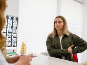 girl at doctor's seeking diagnosis of chronic pain