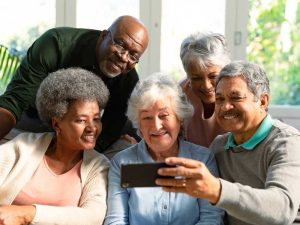 Five happy seniors enjoying quality relationships in older age