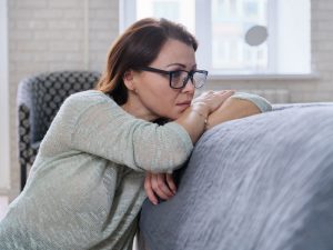 Depressed woman to illustrate emotional and physical hysterectomy recovery