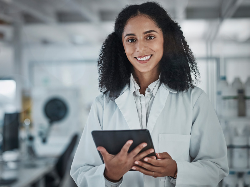 Woman with tablet to illustrate assessing for low progesterone