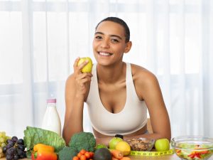 woman eating healthy vegetables to help avoid the need for pow progesterone therapy