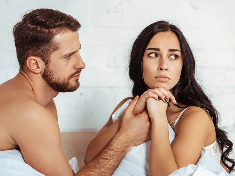 woman turning away from man to illustrate PCOS and low libido