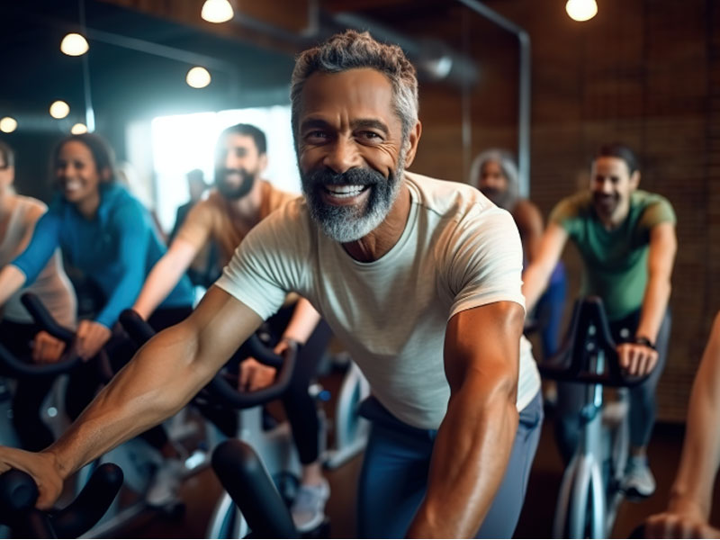 Happy men in a gym to illustrate successful shockwave therapy