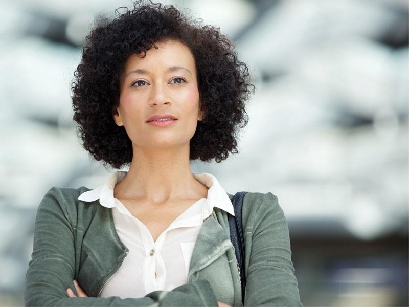 pensive woman to illustrate considering what to expect 4 months after hysterectomy