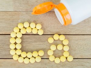 Calcium tablets arranged to spell the chemical abbreviation Ca – to illustrate calcium supplements